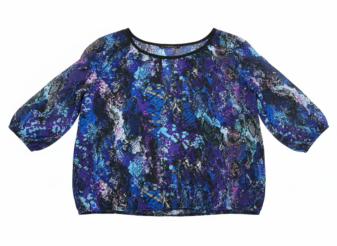 Mixed media crochet tunic by Ashir Studio featuring colorful patterns and textured fabric, worn as casual clothing.