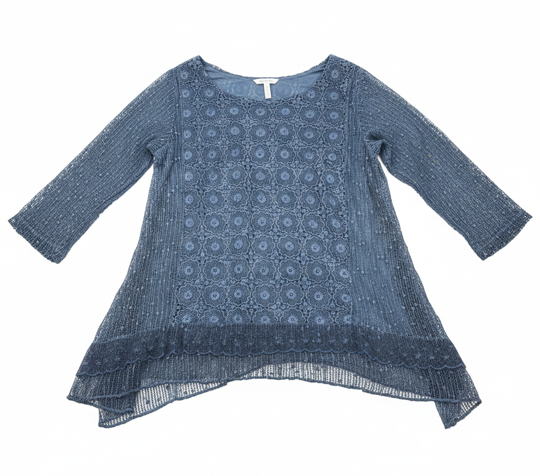 Crochet and lace Shark Bite Tunic by Ashir Studio, showcasing intricate patterns and flowing fabric on a mannequin.