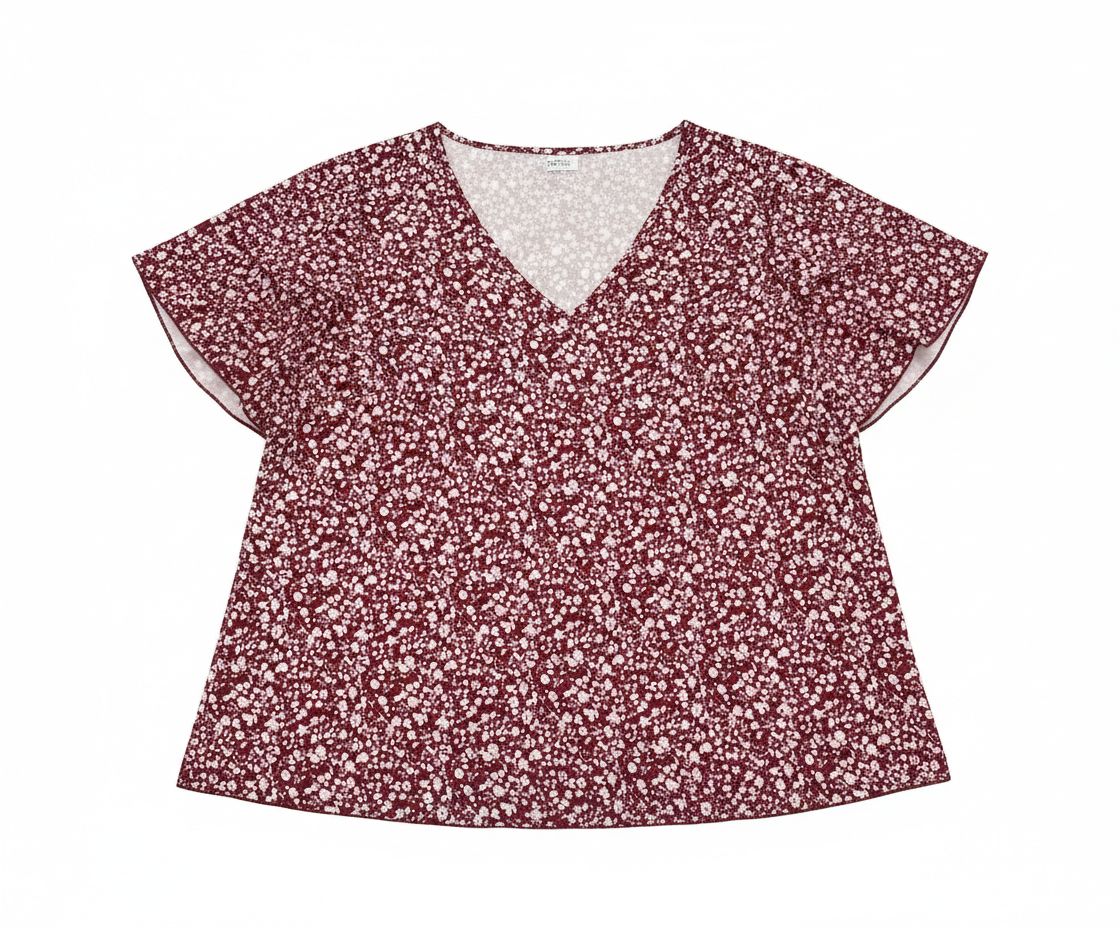 Floral V-neck flutter sleeve blouse by Ashir Studio, featuring a soft fabric and elegant floral pattern, displayed on a hanger.