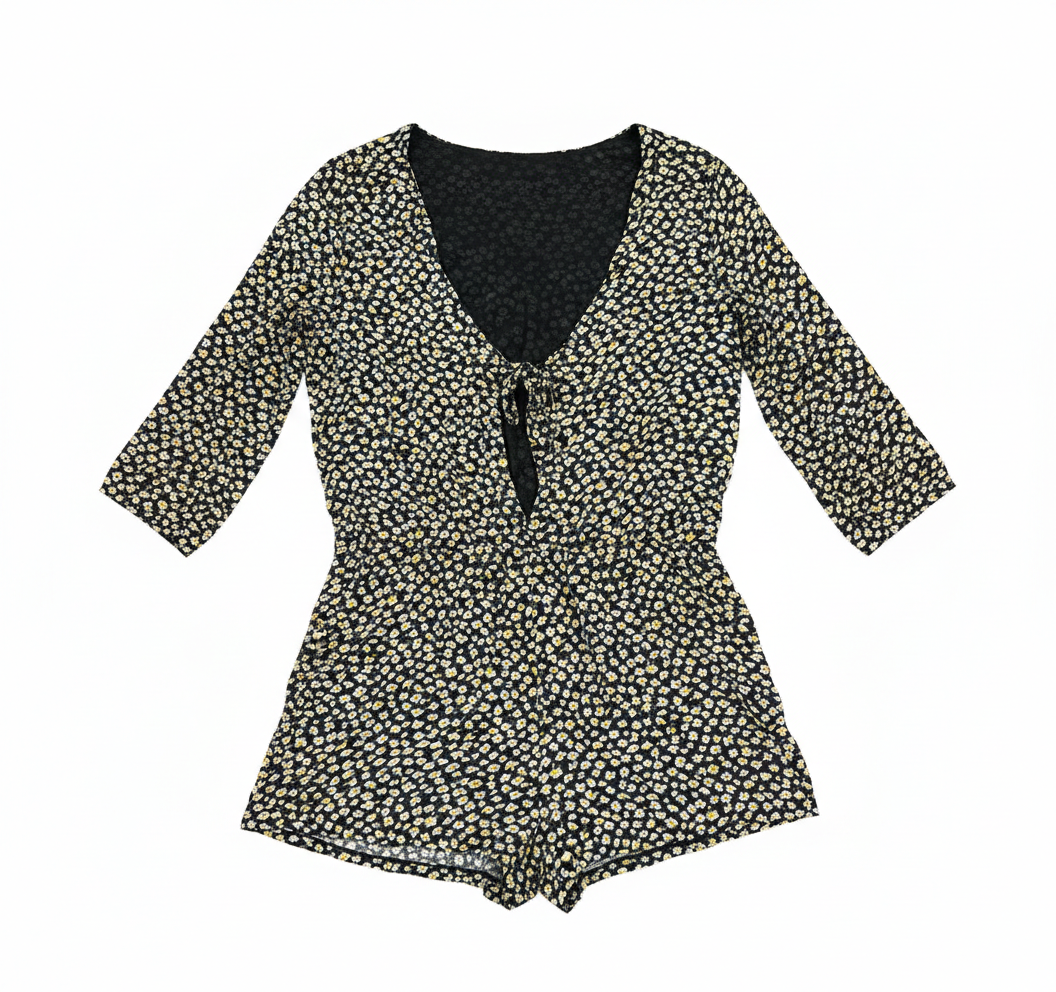 Light blue summer casual daisy romper by Ashir Studio, featuring a relaxed fit and floral print, displayed on a hanger.