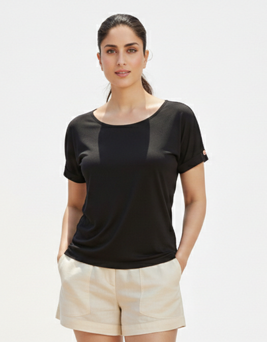 Black short shirt from Ashir Studio, stylish casual clothing shown on a model with a relaxed fit and simple design.
