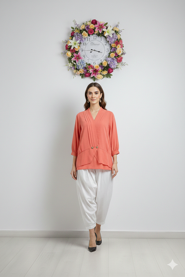 Model wearing Ashir Studio crossover blouse, featuring stylish design and comfortable fabric, shown in a front view.