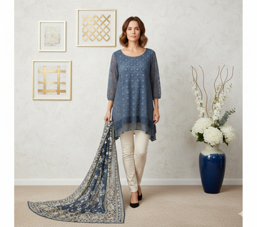 Ashir Studio crochet and lace shark bite tunic worn by a model, showcasing its detailed design and flowing fit.