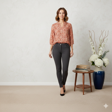 Rust orange butterfly print high-low blouse with button front by Ashir Studio, shown on model in photono45model.png.