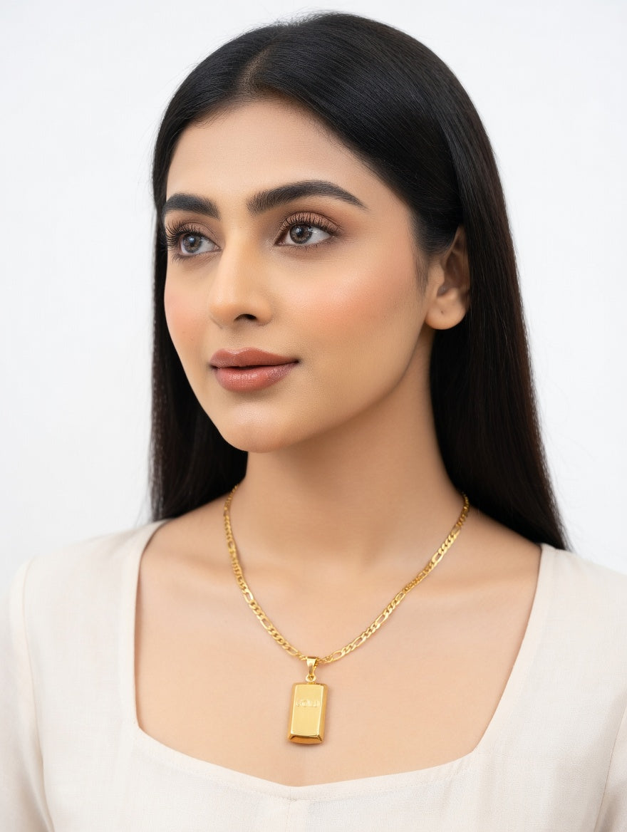 Gold bar pendant and Figaro chain necklace by Ashir Studio featuring a sleek, elegant jewelry design in gold.