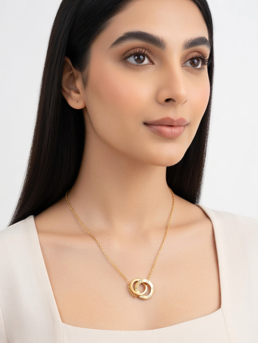 Ashir Studio Interlocking Double Circle Crystal Necklace with sparkling gemstones on a delicate silver chain.
