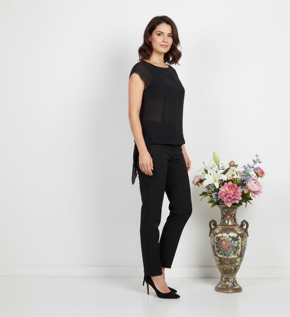 Ashir Studio cap-sleeve blouse in soft fabric, shown on a model with a round neckline and stylish short sleeves.