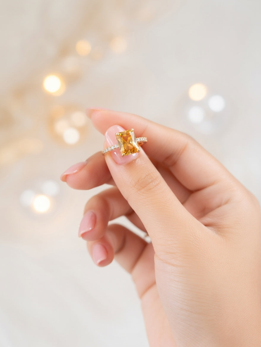 Emerald-cut citrine ring with sparkle accents from Ashir Studio jewelry, showcasing a vibrant yellow-orange gemstone and elegant design.